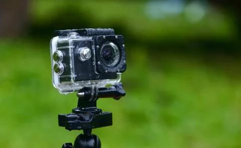 Action camera in a protective cover in the rain. close up shot Stock Photos