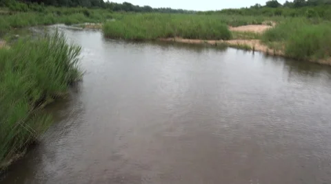 Action camera ride over pond South Africa filmed from Drone Helicopter Stock Footage 56861407