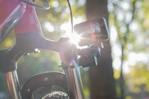 Action camera with a screen on, mounted next to a mountain bike wheel Stock Photos
