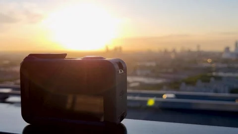 Action Camera shooting City Skyline during Sunrise in 4K, DJI Osmo Action 3 Stock Footage 245739331