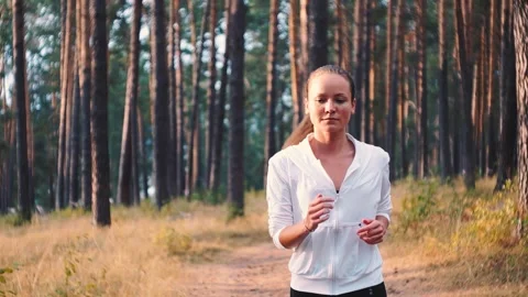 Action camera style. Slowmotion. Young woman running. Female runner jogging on Video stock 247820949