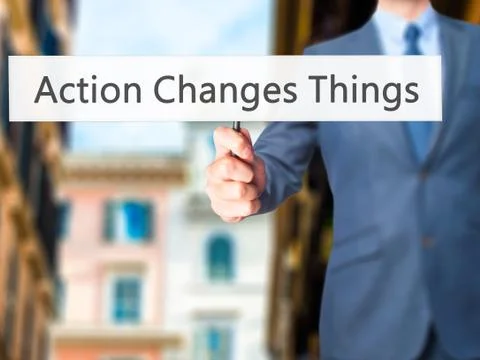 Action Changes Things - Business man showing sign Stock Photos