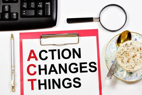 Action changes things. A text label in a working notebook. Stock Photos