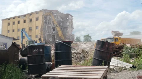 Action on construction site, bulldozer loads waste in truck, building demolition 스톡 동영상 64036820