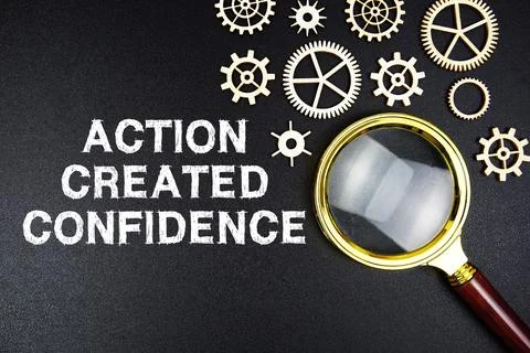 Action Created Confidence text message with magnifying glass on black backg.. Stock Photos