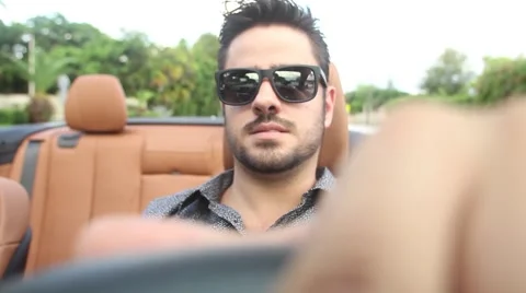 ACTION - guy driving convertible in Miami Stock Footage 65188099