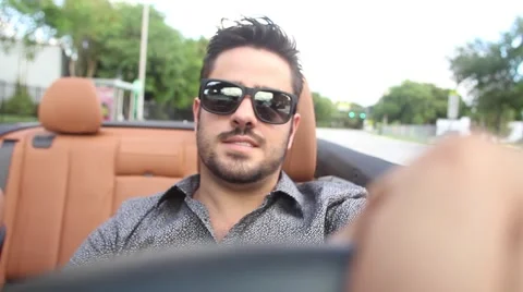 ACTION - Happy guy driving convertible car Stock Footage 65188080