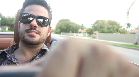 ACTION - Happy guy driving convertible Stock Footage 65188176