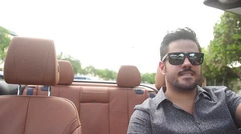 ACTION - Man driving a convertible Stock Footage 65188102