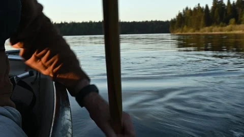 Action of a person canoeing with the focus on the hands and paddle. On northern  Stock Footage 295077519