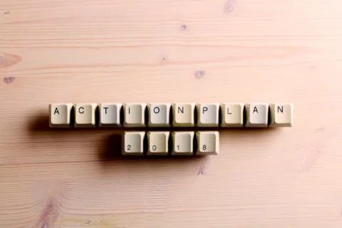 Action plan 2018 on computer keyboard keys buttons on a wooden background Foto stock