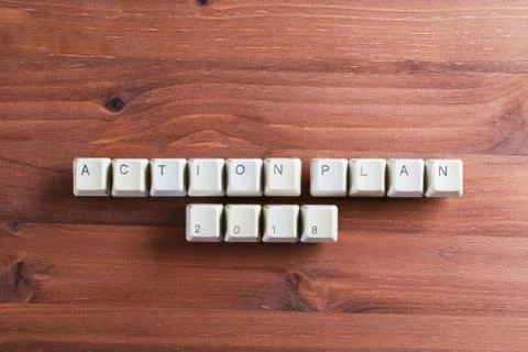 Action plan 2018 on computer keyboard keys buttons on wooden background Foto stock