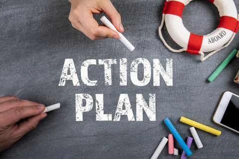 Action Plan concept. Colored chalk and office supplies on a black chalk board Stock Photos