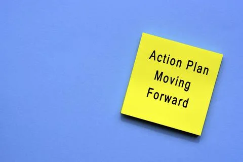 Action plan moving forward text on yellow sticky note Stock Photos