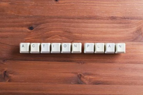 Action plan words on keyboard on computer keyboard keys on wooden background Foto stock