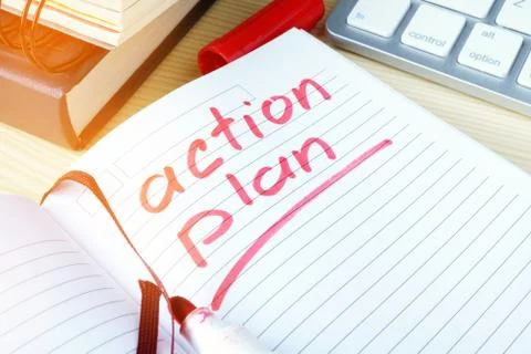 Action plan written in a note. Stock Photos