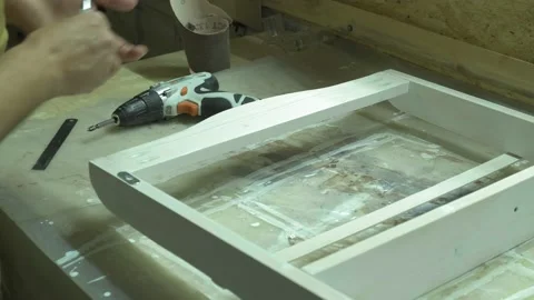 Action. A professional carpenter is working on a project in his workshop Stock Footage 173250391