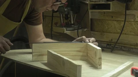 Action. A professional carpenter is working on a project in his workshop Stock-Footage 175278981