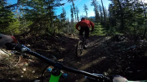 Action Sequence Of A Mountain Biker Following Another Biker At High Speed On A T Video stock 87054270