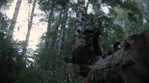 Action shot, an armed special forces soldier with a sniper rifle Stock Footage 327351538