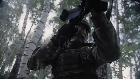 Action shot, an armed special forces soldier with a rifle in his hands Stock Footage 327352472