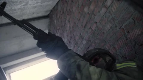 Action shot of an armed special forces soldier with a rifle Stock Footage 327358350