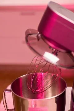 An action shot of a kitchen mixer in the process of being used for baking, sh Stock Photos