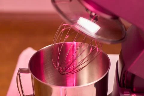 An action shot of a kitchen mixer in the process of being used for baking, sh Stock Photos