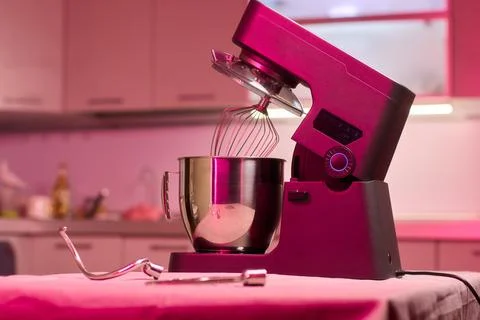 An action shot of a kitchen mixer in the process of being used for baking, sh Stock Photos