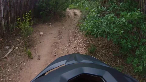 Action shot of Mountain biking down dirt path 스톡 동영상 220591009