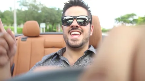 ACTION - singing in convertible Stock Footage 65188111