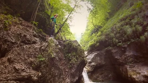 Action video of boy doing somersault into canyon pool in Soca valley, Slovenia. Stock Footage 97060869