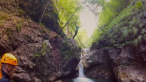Action video of boy jumping into canyon pool in the Soca valley in Slovenia. Stock Footage 97060740