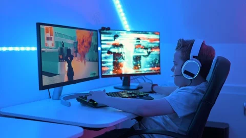 Action video game with guns on computer at home Stock Footage 122524564