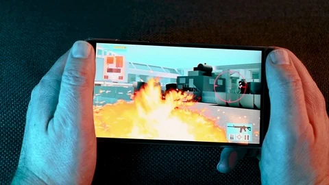 Action video game played on smart phone at night Stock Footage 101077819