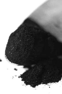 Activated charcoal powder Stock Photos