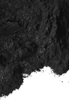 Activated charcoal powder Stock Photos