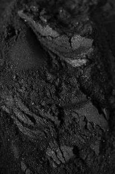 Activated charcoal powder Stock Photos