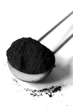Activated charcoal powder Stock Photos