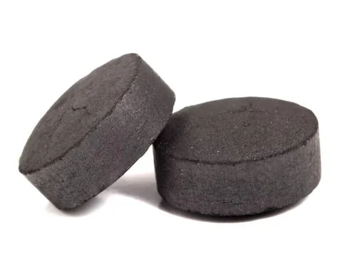 Activated coal on the isolated background Stock Photos