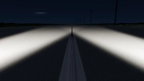 Activating headlights, low view advancing down rural two-lane night road with Stock Footage 344173832