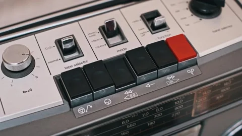 Activating Rewind Button on Retro Cassette Player Stock Footage 303895052