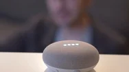 Activating A Smart Home Assistant Speaker By Voice Google Home Stock Footage