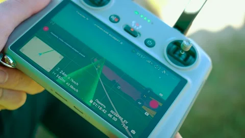 Activating smart return home after aerial filming on drone controller close-up Stock Footage 313684146
