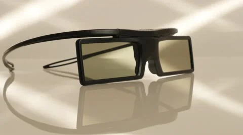 Active 3D TV glasses on white reflective surface slow tilt 4K 2160p UltraHD f Stock Footage 50897514