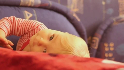 Active 9 months old baby boy playing and posing Stock Footage 82299579