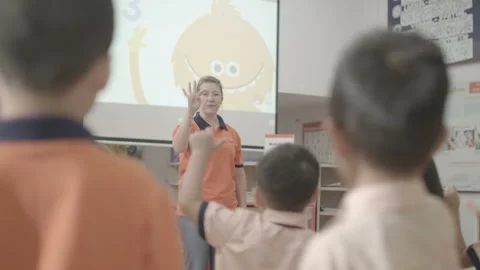 Active and caring teacher is teaching at kindergarten Stock Footage 134231818