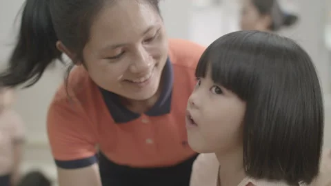 Active and caring teacher is teaching at kindergarten Stock Footage 134231826