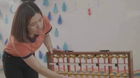 Active and caring teacher is teaching at kindergarten Stock Footage 134231860