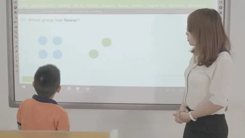 Active and caring teacher is teaching at kindergarten Stock Footage 134231943